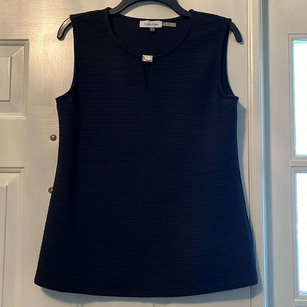 Calvin Klein shirt. Beautiful with front gold Calvin Klein label.
